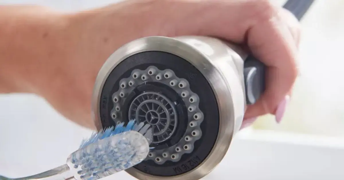 how to clean a faucet head