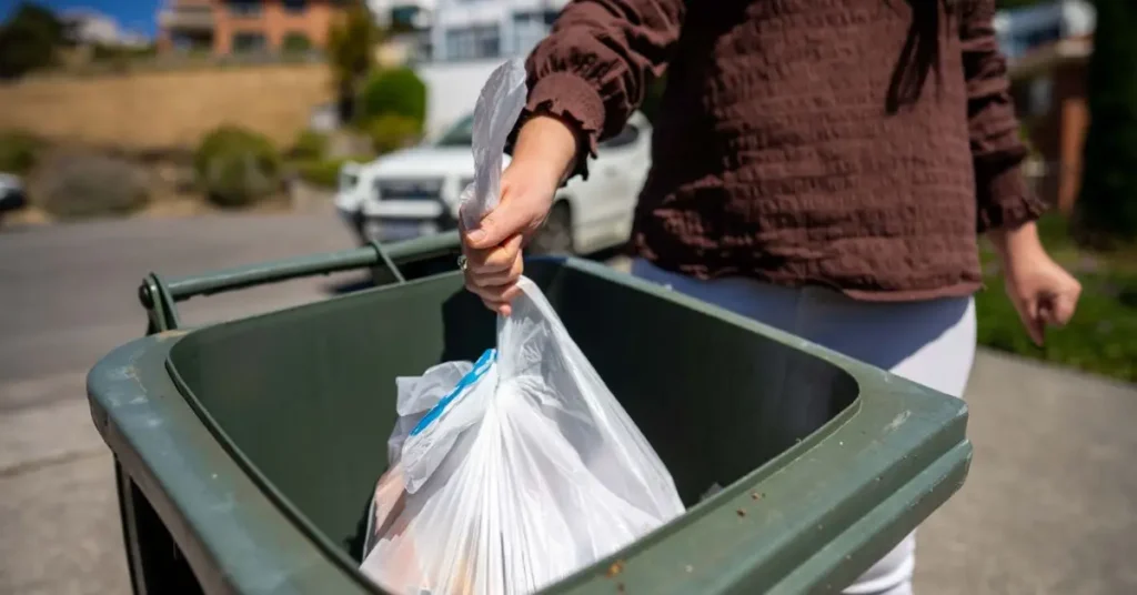 can you put overflow trash in a neighbors bin
