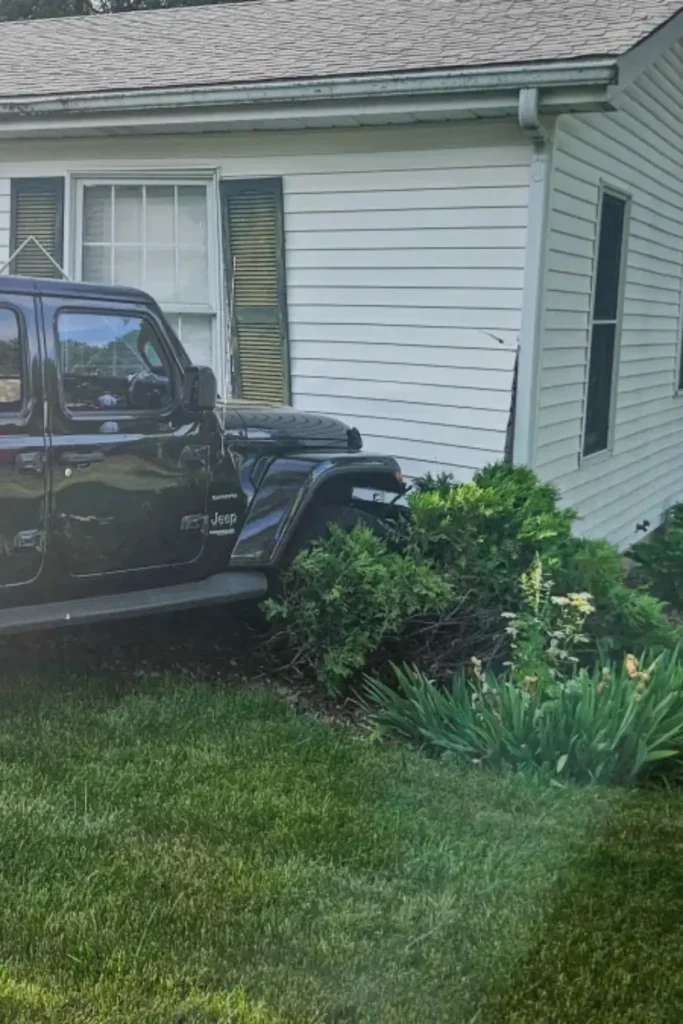 Black Jeep Slams Into Illinois Home